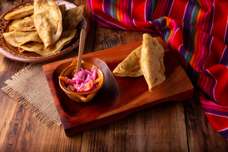 Golden quesadillas. Fried quesadillas made with corn tortillas, they can be filled with any dish or ingredient, such as meat, potato or fish such as marlin or tuna, popular during the Lenten season.の写真素材