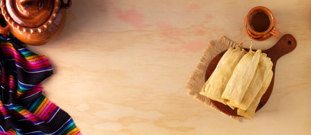 Tamales. Prehispanic dish typical of Mexico and some Latin American countries. Corn dough wrapped in corn leaves. The tamales are steamed.の写真素材