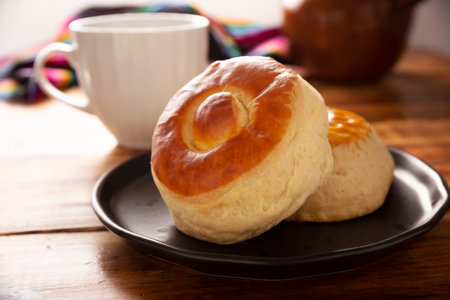 Biscuit. Also known as Bisquets Chinos, it is one of the traditional breads in Mexico, commonly consumed hot, cut in half and spread with butter and fruit jam.の写真素材