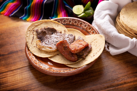 Roast meat. (roast meat) very popular dish in northern Mexico, also called Asado, Discada or Parrillada, is a cooking technique in which food is exposed to the heat of the embers.の写真素材