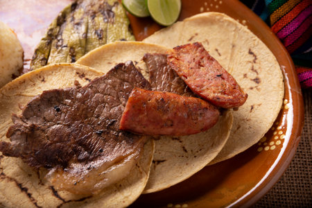 Roast meat. (roast meat) very popular dish in northern Mexico, also called Asado, Discada or Parrillada, is a cooking technique in which food is exposed to the heat of the embers.の写真素材