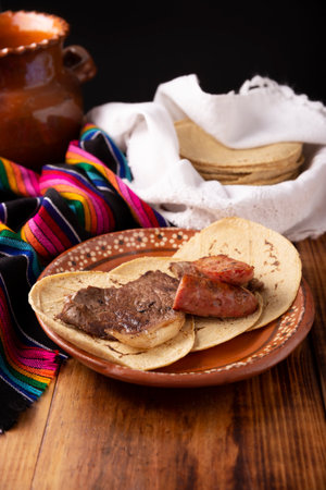 Roast meat. (roast meat) very popular dish in northern Mexico, also called Asado, Discada or Parrillada, is a cooking technique in which food is exposed to the heat of the embers.の写真素材