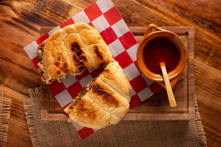 Suadero cake. Torta in Mexico is a type of sandwich that is generally made with a bread called Telera. Suadero, fried and minced meat widely used in the typical Mexican street tacos.の写真素材