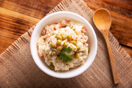 Russian Salad, also known as Oliver Salad. Very popular dish in several countries, the main ingredients are commonly potatoes, mayonnaise and vegetables such as peas, carrots, boiled eggs or chicken.の写真素材