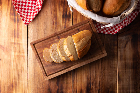 Sliced bread Bolillo. Traditional mexican bakery. White bread commonly used to accompany food and to prepare Mexican sandwiches called Tortas.の写真素材