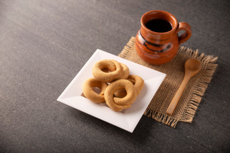 Coricos, Mexican cornmeal cookies. Also known as Harinillas de maÃ­z crudo, Tacuarines, Ensecos, Biscochuelos, Coricochis or Pemoles, accompanied by a traditional pot coffee.の写真素材