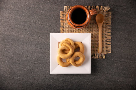 Coricos, Mexican cornmeal cookies. Also known as Harinillas de maÃ­z crudo, Tacuarines, Ensecos, Biscochuelos, Coricochis or Pemoles, accompanied by a traditional pot coffee.の写真素材