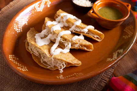Potato quesadillas. Fried quesadillas made with corn tortillas, they can be filled with any dish or ingredient, such as meat, potato or fish such as marlin or tuna, popular during the Lenten season.の写真素材