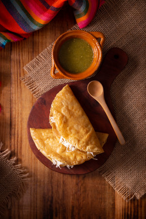 Potato quesadillas. Fried quesadillas made with corn tortillas, they can be filled with any dish or ingredient, such as meat, potato or fish such as marlin or tuna, popular during the Lenten season.の写真素材