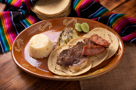 Roast meat (carne asada) very popular dish in northern Mexico, also called Asado, Discada or Parrillada, is a cooking technique in which food is exposed to the heat of the embers.の写真素材