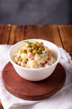 Russian Salad, also known as Olivier Salad. Very popular dish in several countries, the main ingredients are commonly potatoes, mayonnaise and vegetables such as peas, carrots, boiled eggs or chicken.の写真素材