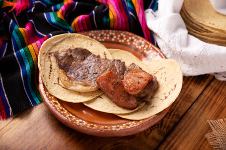 Country style taco, Carne Asada. (roast meat) and chorizo or longaniza, very popular dish in northern Mexico, also called Asado, Discada or Parrillada.の写真素材