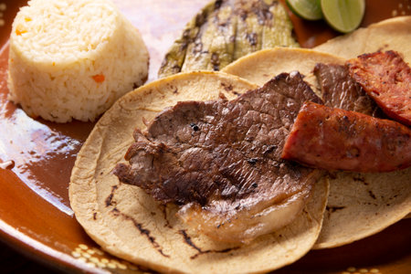 Country style taco, Carne Asada. (roast meat) and chorizo or longaniza, very popular dish in northern Mexico, also called Asado, Discada or Parrillada.の写真素材
