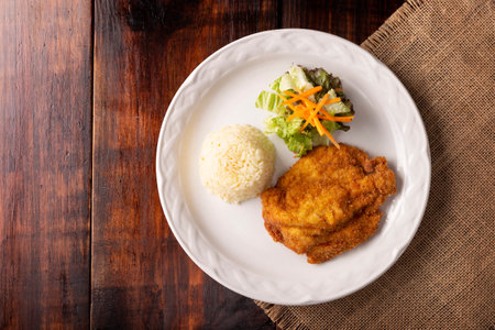 Chicken Milanese. Delicious crispy, quick and easy recipe, made with thin skinless and boneless chicken breasts or cutlets, lightly breaded and deep fried.の写真素材