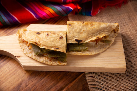 Comal Quesadilla with cheese and Nopales. Typical Mexican quesadilla made on a comal, very popular dish, one of the main street food in Mexico.の写真素材