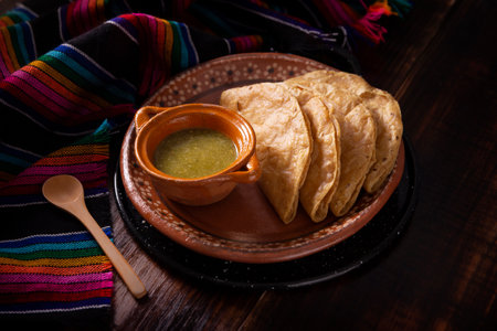 Golden quesadillas. Fried quesadillas made with corn tortillas, they can be filled with any dish or ingredient, such as meat, potato or fish such as marlin or tuna, popular during the Lenten season.の写真素材