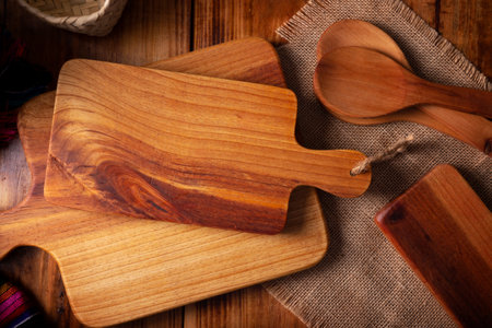 Empty rustic wooden cutting board for kitchen on old rustic wooden table. Table top view view.の写真素材