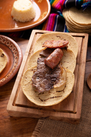 Country style taco, Carne Asada. (roast meat) and chorizo or longaniza, very popular dish in northern Mexico, also called Asado, Discada or Parrillada.の写真素材