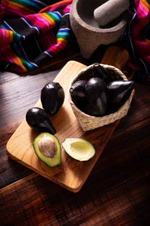Creole Avocado. Home harvest of "criollo avocado", this variety is the ancestor of the domesticated varieties that we know today, they are small with thin black skin and large seed.の写真素材