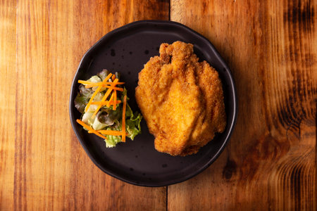 Chicken Milanese. Delicious crispy, quick and easy recipe, made with thin skinless and boneless chicken breasts or cutlets, lightly breaded and deep fried.の写真素材