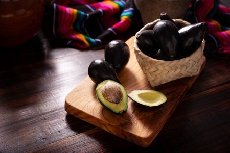 Creole Avocado. Home harvest of "criollo avocado", this variety is the ancestor of the domesticated varieties that we know today, they are small with thin black skin and large seed.の写真素材