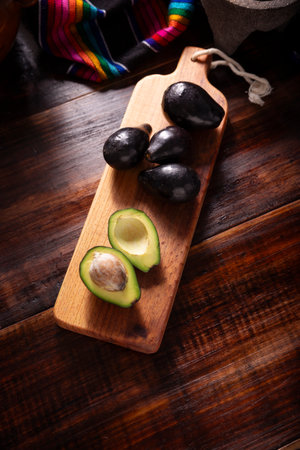 Creole Avocado. Home harvest of "criollo avocado", this variety is the ancestor of the domesticated varieties that we know today, they are small with thin black skin and large seed.の写真素材