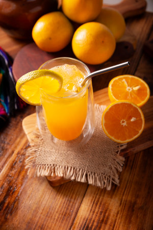 Refreshing homemade orangeade, a natural hydrating drink made from orange juice, very popular in several countries, ideal to drink in hot summers.の写真素材
