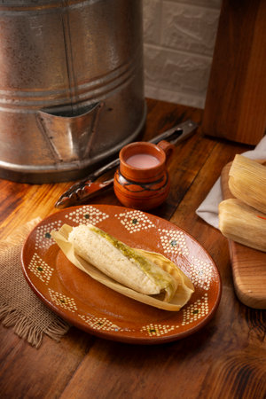 Tamales. hispanic dish typical of Mexico and some Latin American countries. Corn dough wrapped in corn leaves. The tamales are steamed.の写真素材