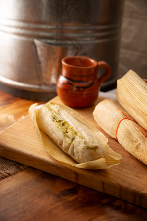 Tamales. hispanic dish typical of Mexico and some Latin American countries. Corn dough wrapped in corn leaves. The tamales are steamed.の写真素材