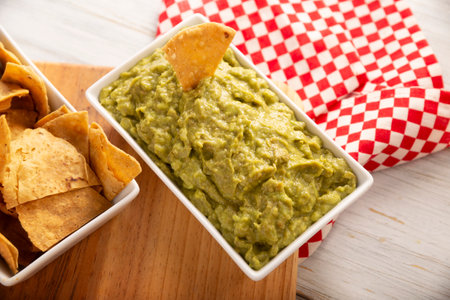 Guacamole. Avocado dip sauce, one of its many ways of consuming it is spread on tortilla chips also called Nachos. Mexican easy homemade sauce recipe very popular.の写真素材