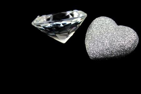Diamond and heart on blac backgroundの写真素材