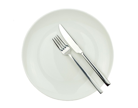 Knife, fork and plate isolated on white background