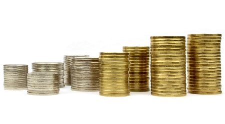 Stacked coins on white backgroundの写真素材