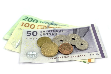 Danish kroner, coins and banknotes on white background の写真素材