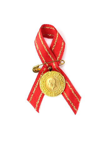 Turkish traditional coins with red ribbon  Quarter  and half gold,の写真素材
