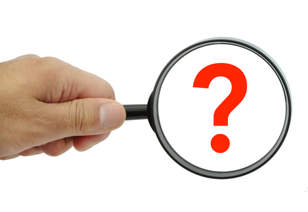 Magnifying glass with red question mark on white backgroundの写真素材
