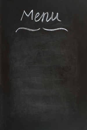 "Menu"  written with chalk on black boardの写真素材