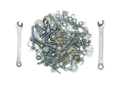 Wrenches, bolts, nuts, screws and washers . Conceptual image of fork and knife like  a meal