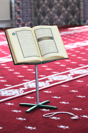 Quran on a stand in mosque. Quran is holy book religion of Islamの写真素材