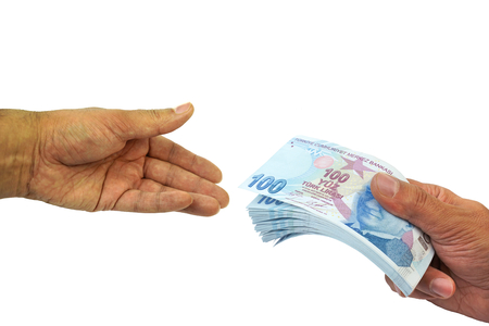 Paying money. Turkish Lira - TRY  or  TL on white background.の写真素材