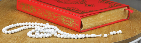 Quran and rosary beads. Quran is holy book religion of Islam