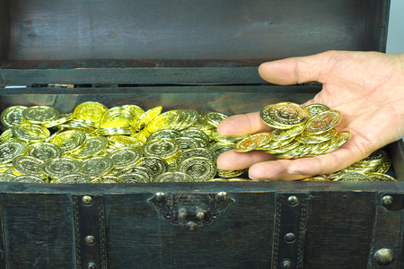 Treasure chest filled with gold coinsの写真素材