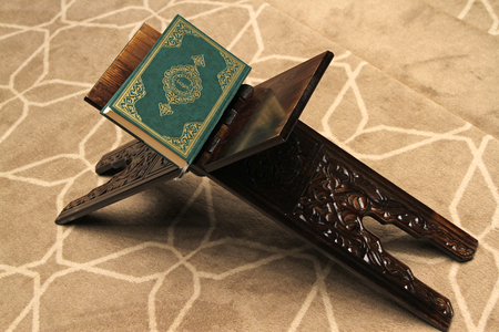 Quran on a wooden stand in mosque. Quran is holy book religion of Islam
