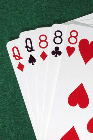 Poker hand, full house, queens and eights.