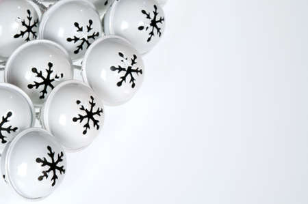 Snowflake adorned white bells cover the upper left of the frame, leaving room for text.