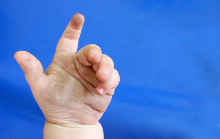 Baby hands dirty, full of bacteria and germs