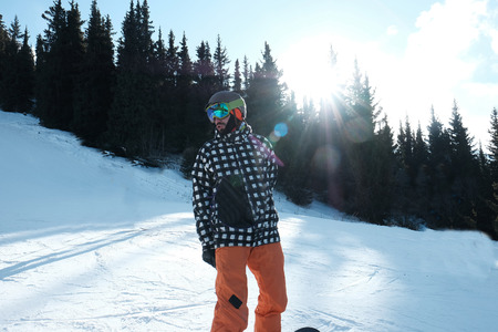 portrait of a snowboarder in a helmet and glassesの写真素材