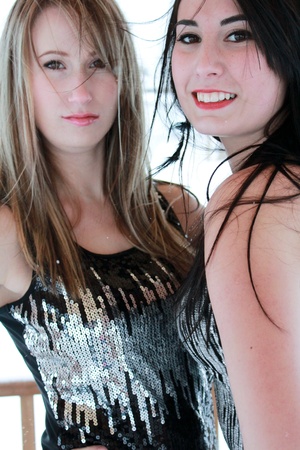 Two beautiful women standing outside の写真素材