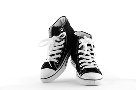 Black and white sneakers isolated on white background with copy space for your text.の写真素材