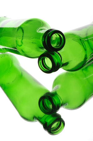 Green beer bottles isolated on a white background. close-up.の写真素材